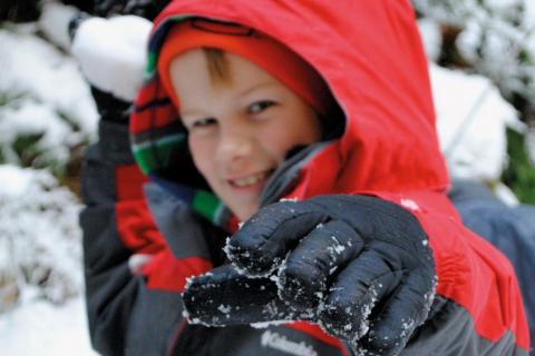 Child playing in the snow